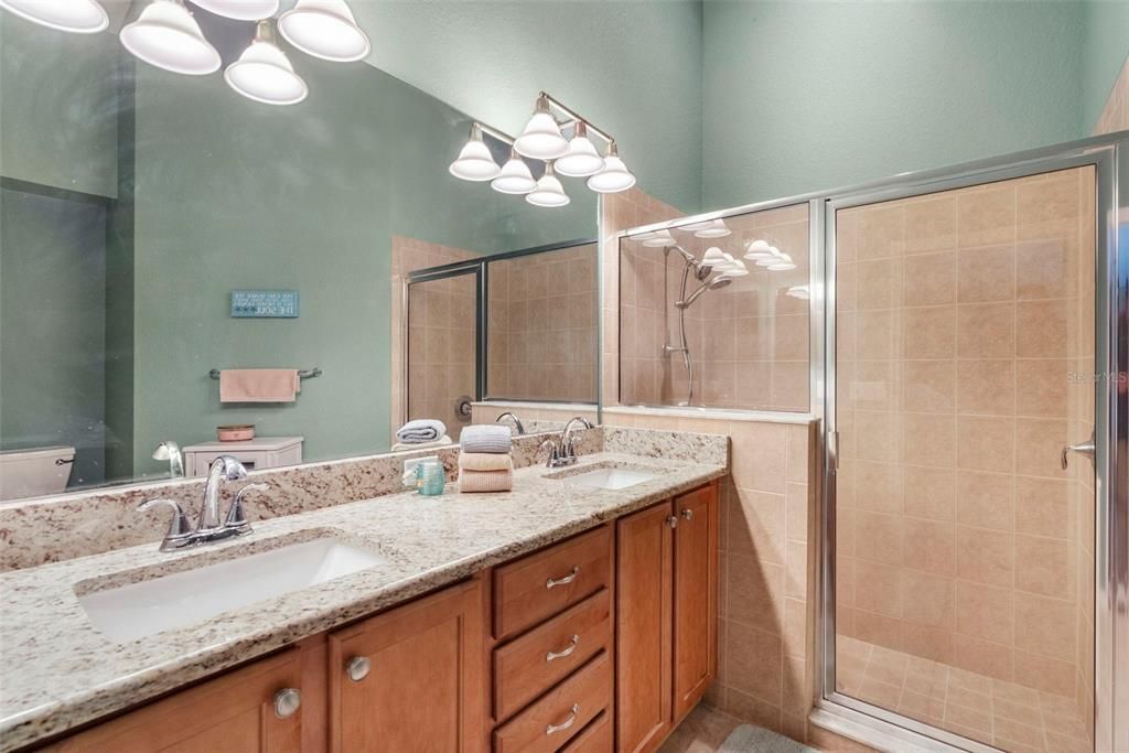 Updated primary bathroom with walk-in shower.