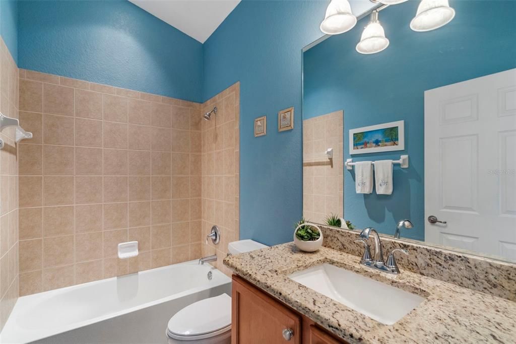 Guest bathroom with tub/shower combo.