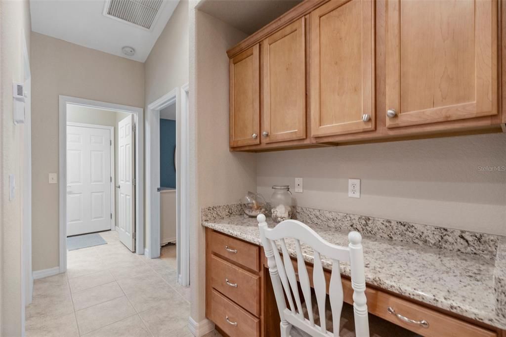 Built-in desk with matching granite countertop.