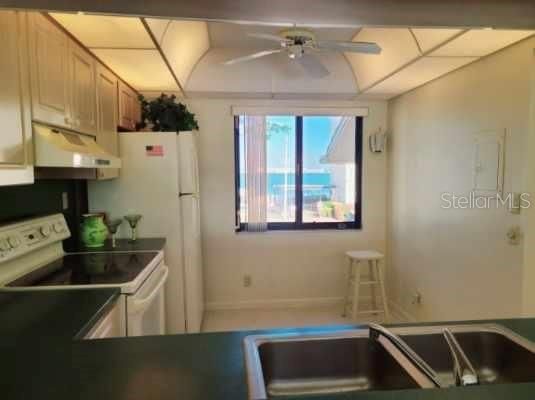 Wallpaper removed & freshly painted kitchen