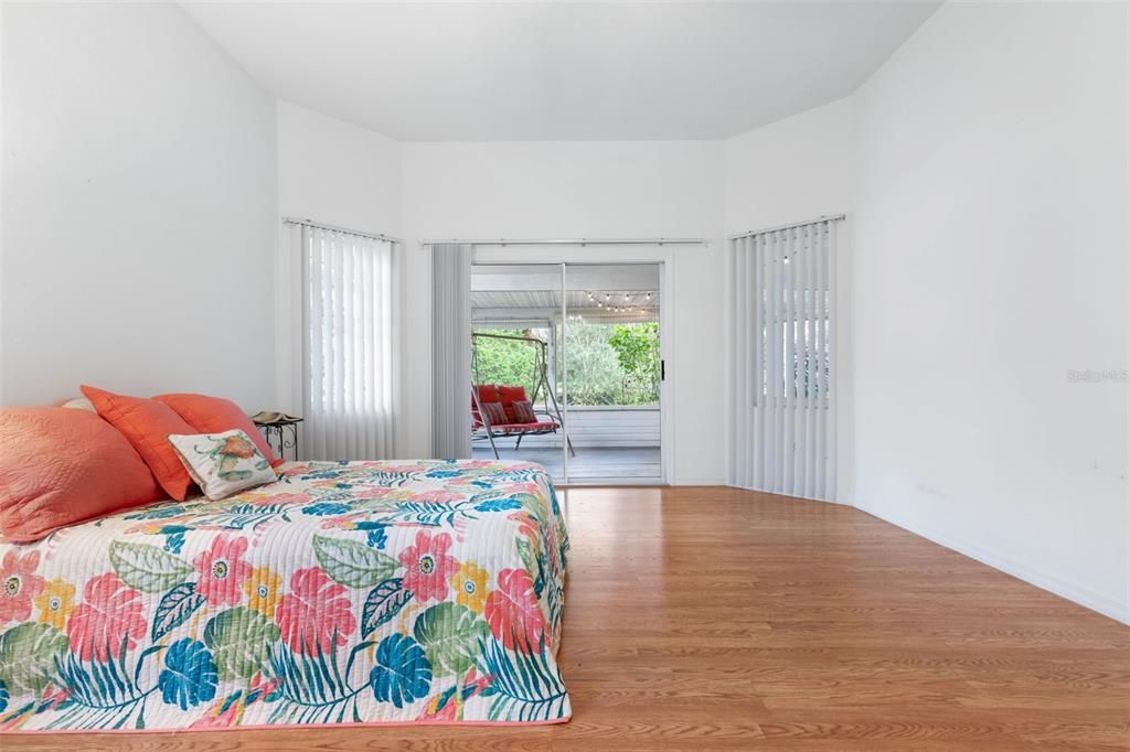 Primary Bedroom with sliders to screened lanai