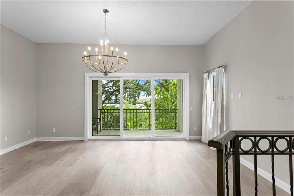 10+ Foot Ceilings -- At the top of the steps, you enter the living room with great natural light and balcony overlooking the Sparkman Channel