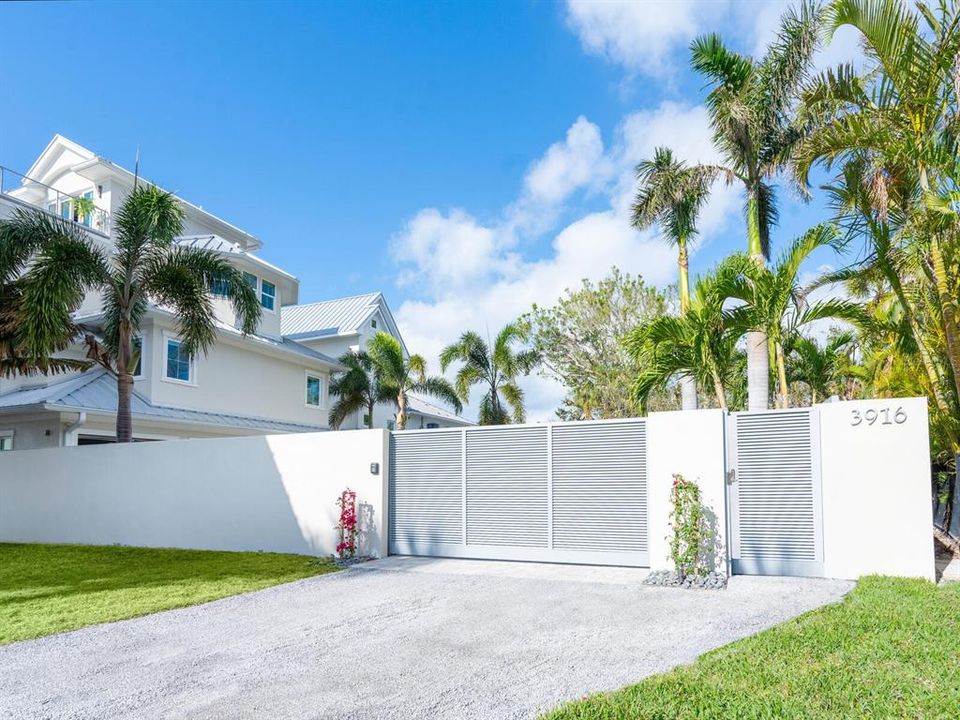 Completely walled property with security gate.