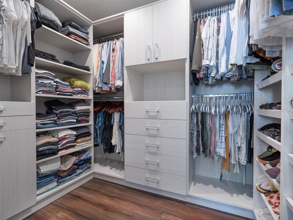 Custom designed built-ins in walk-in closet.