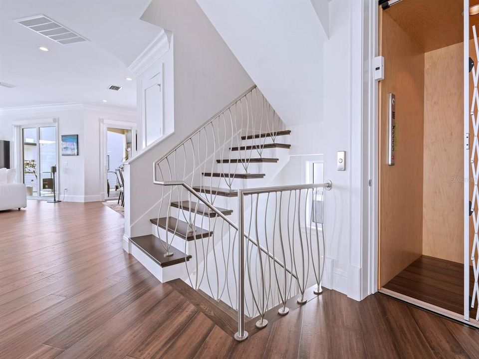 Custom designed handrails on all interior stairs. Interior elevator services all 4 floors.