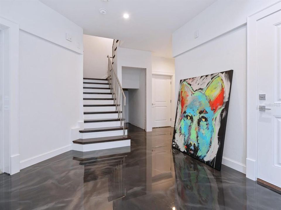 Entry foyer with metallic epoxy flooring.