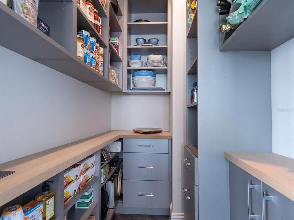 Walk-in pantry with custom designed built-ins.