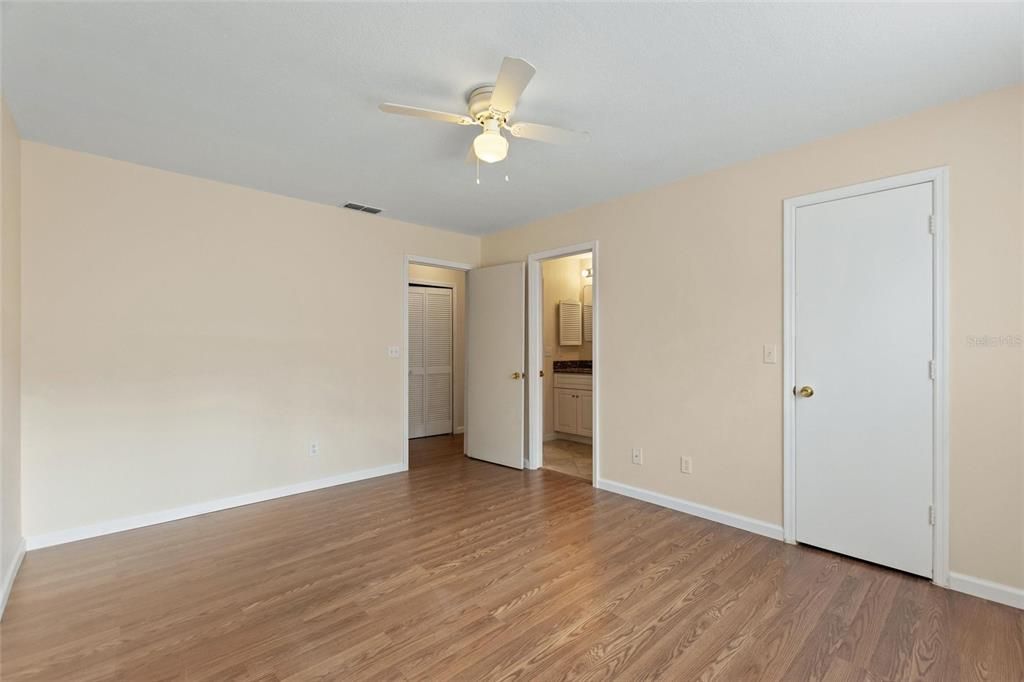 Bedroom 1 with door to shared guest bathroom