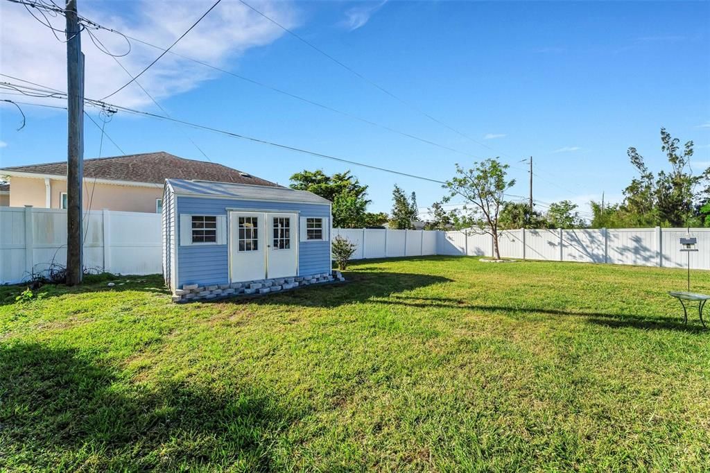 Large backyard with storage shed