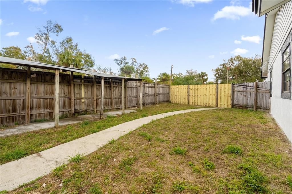 Fully Fenced Backyard with Storage Shed