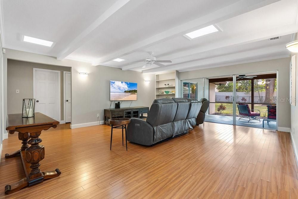 Living Room with skylights and built-in shelving