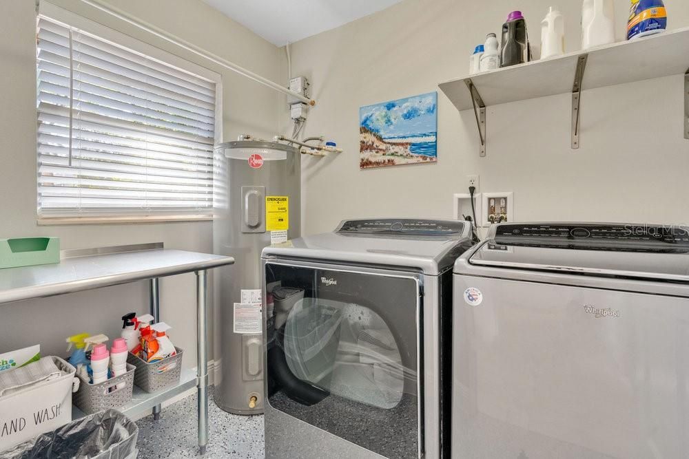 Interior Laundry Room with floor drain and newer water heater