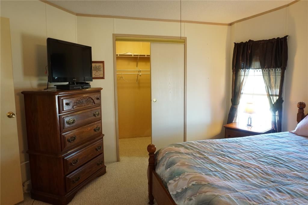 Primary bedroom with walk-in closet