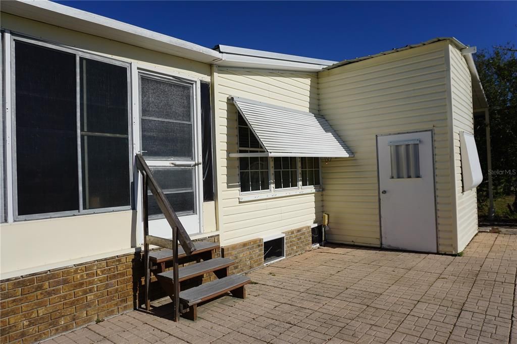 Rear patio and additional attached storage building