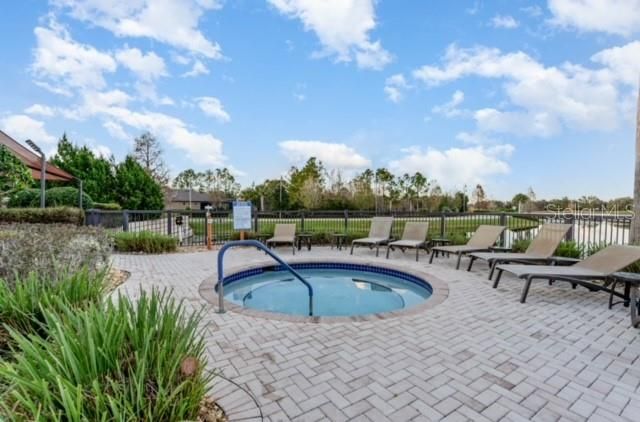 Hot tub along back of pool area