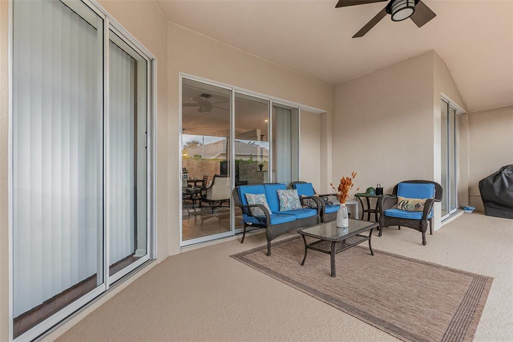 Amazing extra long lanai fully covered with sliding patio doors and 4 separate door entrances.