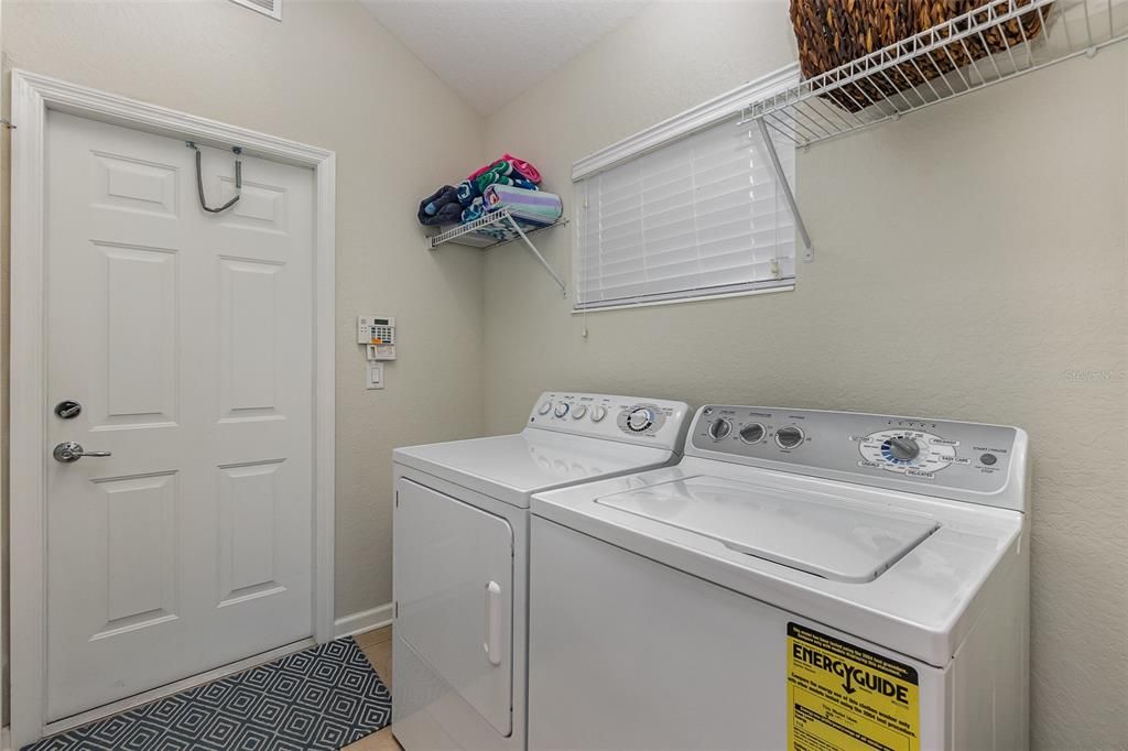 Tons of room with this inside laundry room equipped with broom closetand extra pantry next to kitchen. Washer & dryer included.