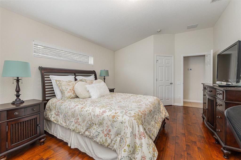 Extra wide primary bedroom with walk-in closet