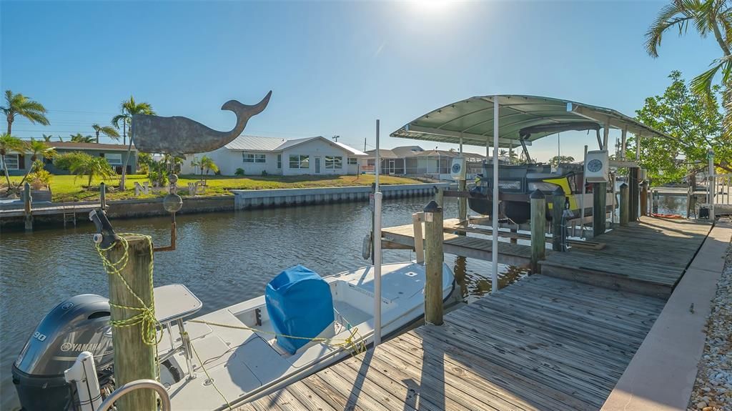 Floating dock and cover for boat.