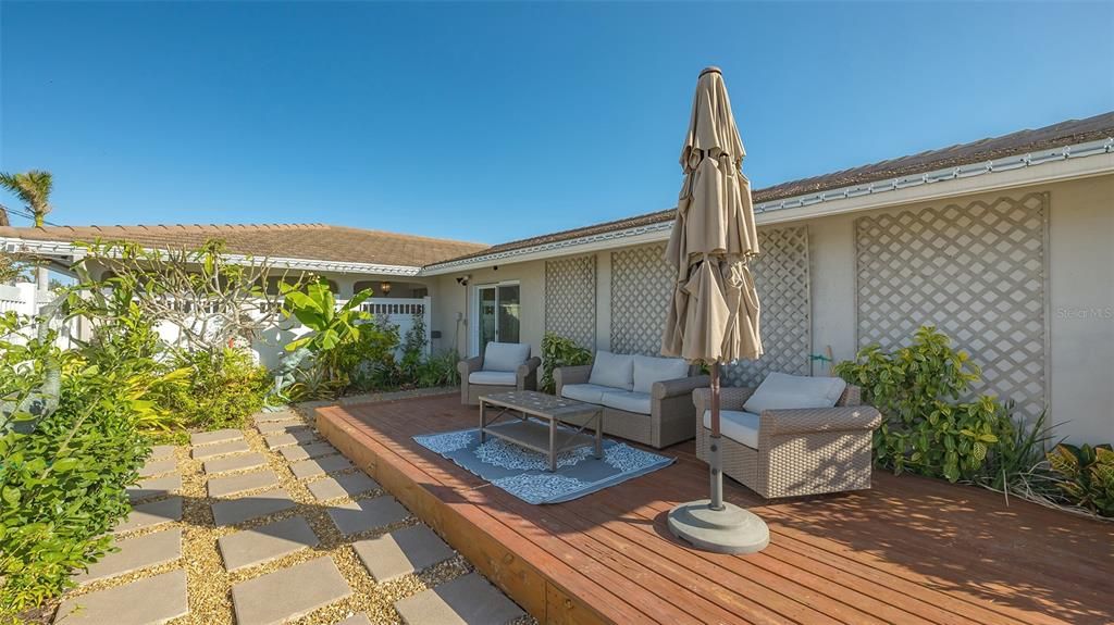 Front patio with privacy fence.