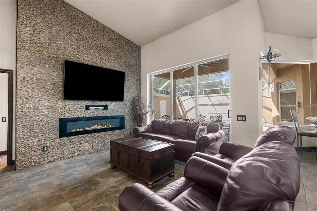 Rock accent wall with electric fireplace to add warmth to the home!