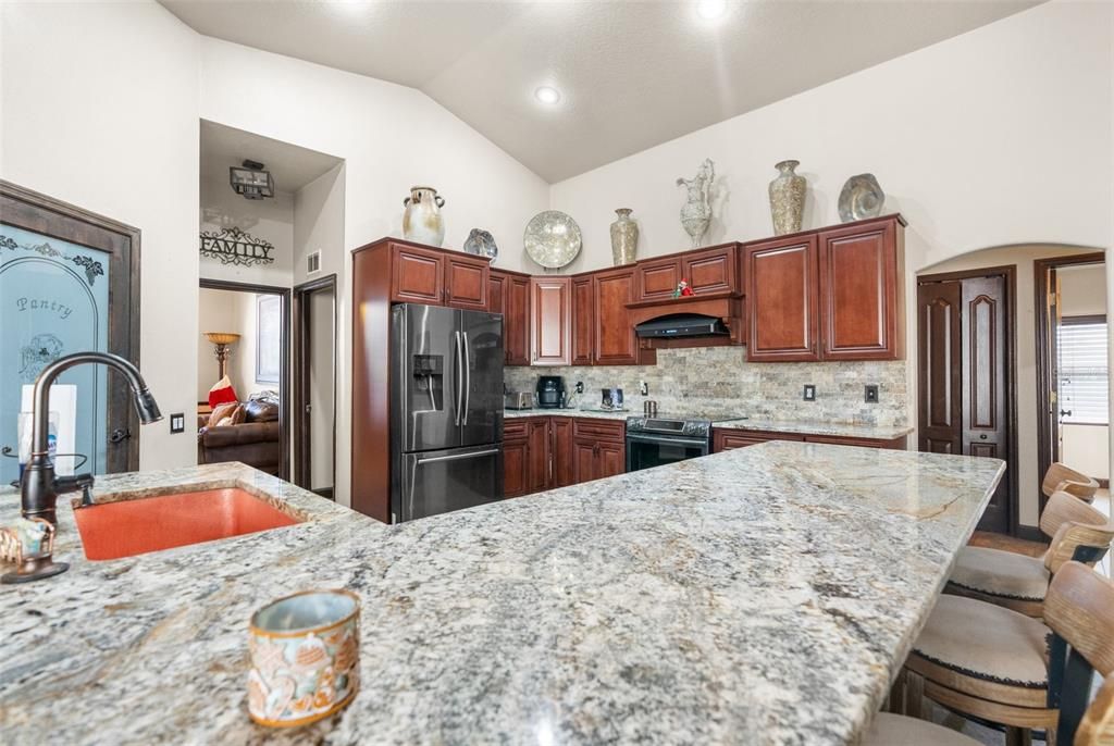 Large granite breakfast bar for extra seating!