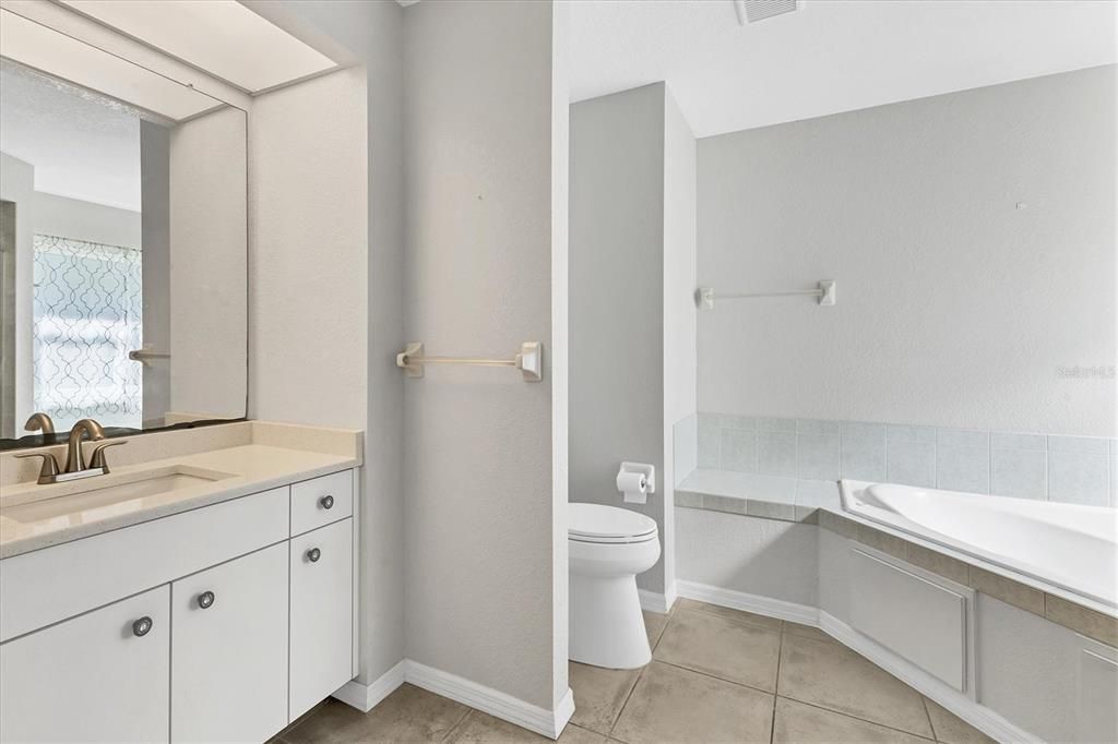 Primary Bathroom (includes walk in shower and soaking tub)