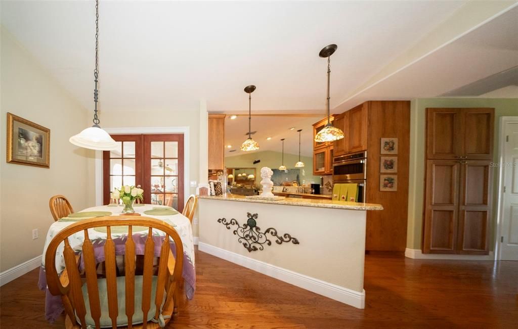 Dining area with custom pantry to the right.