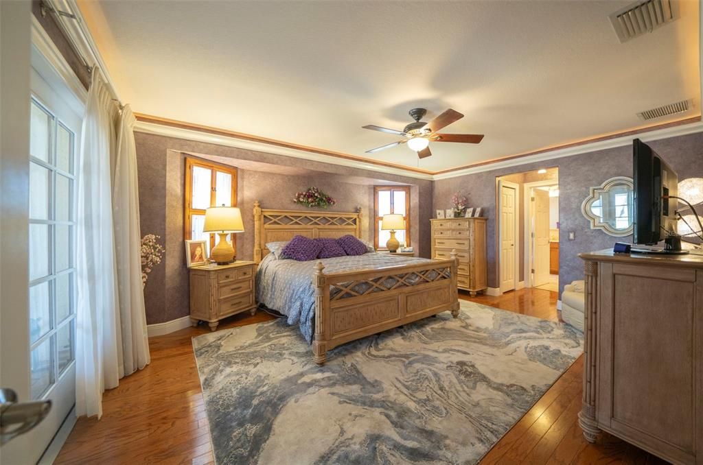 Primary bedroom with French doors to the lanai. Separate side of the home from the guest bedrooms