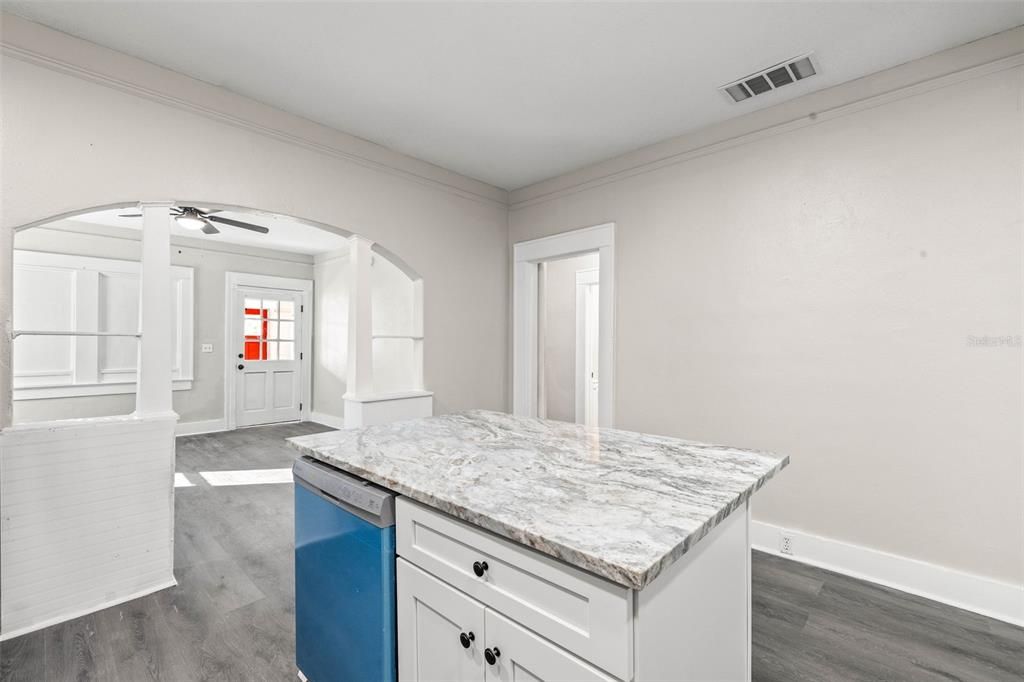 Kitchen with white shaker cabinets, new appliances, Center Island, and stainless steel sink