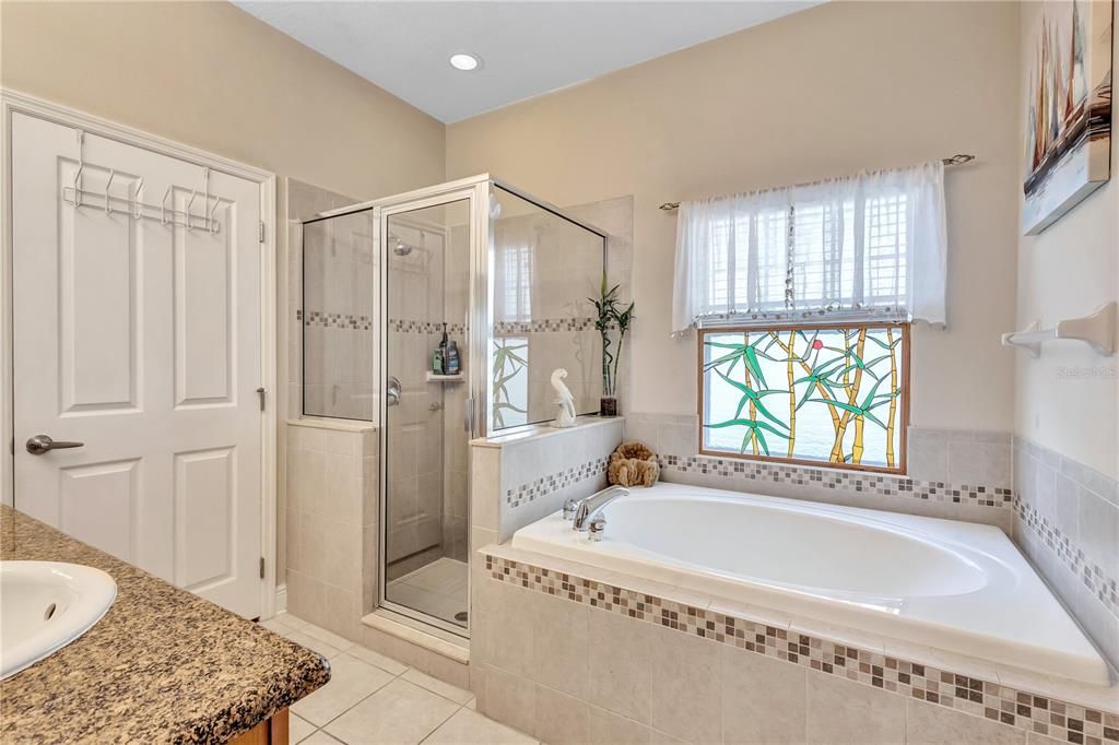 Primary bathroom with tub and separate shower and W.C.