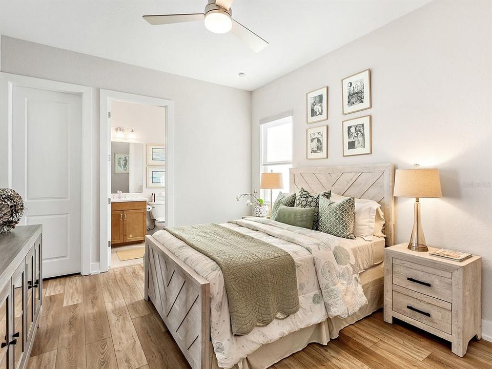 Guest Bedroom 1 with ensuite bath and walk in closet.