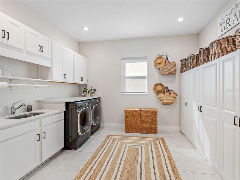 Oversized laundry room with built-in storage