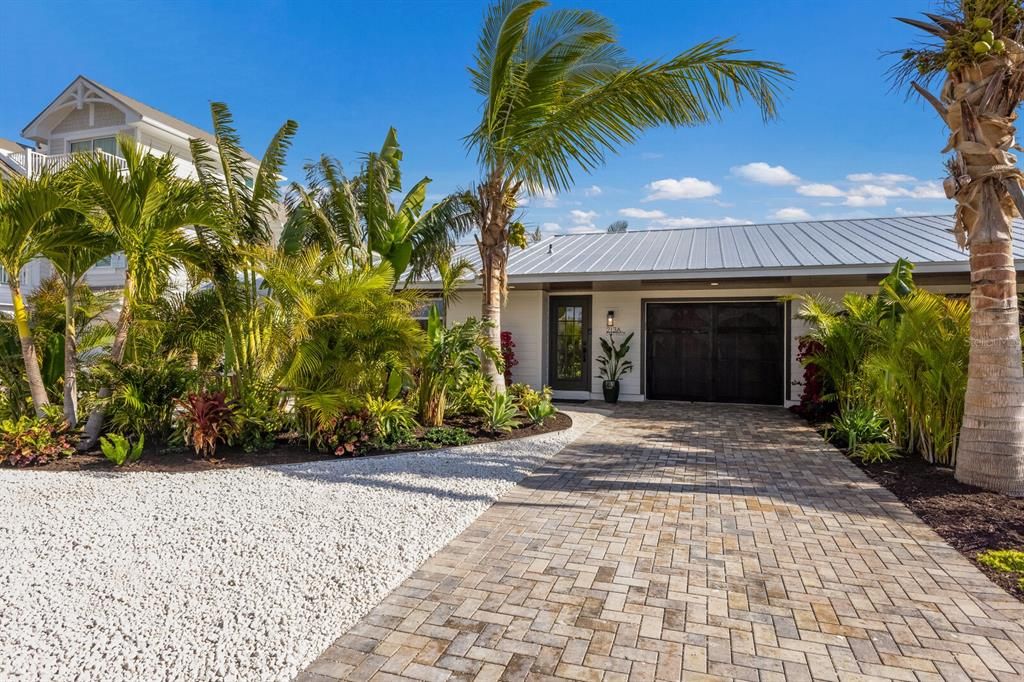 New paved driveway and custom impact garage door