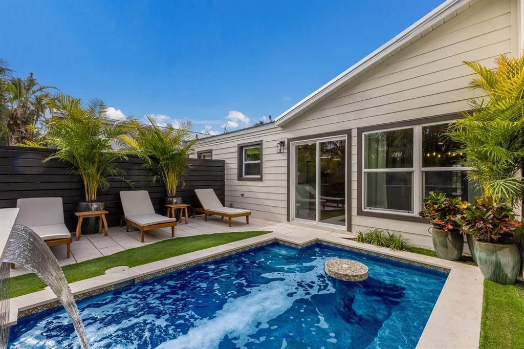 Heated saltwater pool w/ spa features and specialty lighting