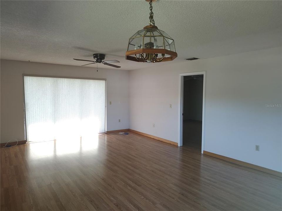 Primary bedroom through door at right