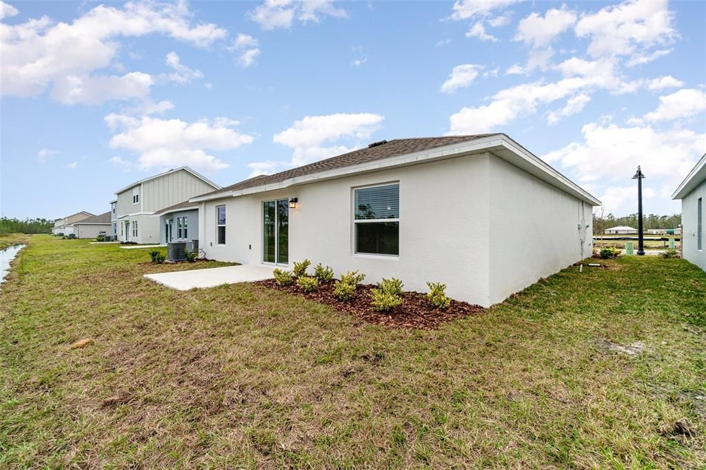 Back of property with patio.