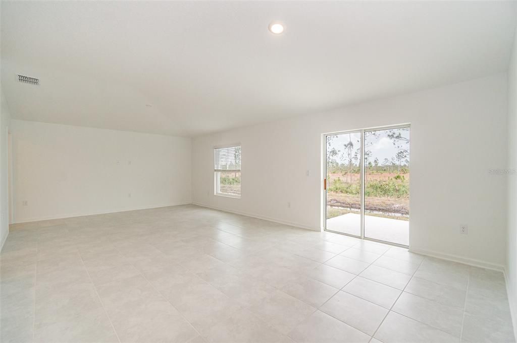 Sliding glass doors to back yard and conservation area.