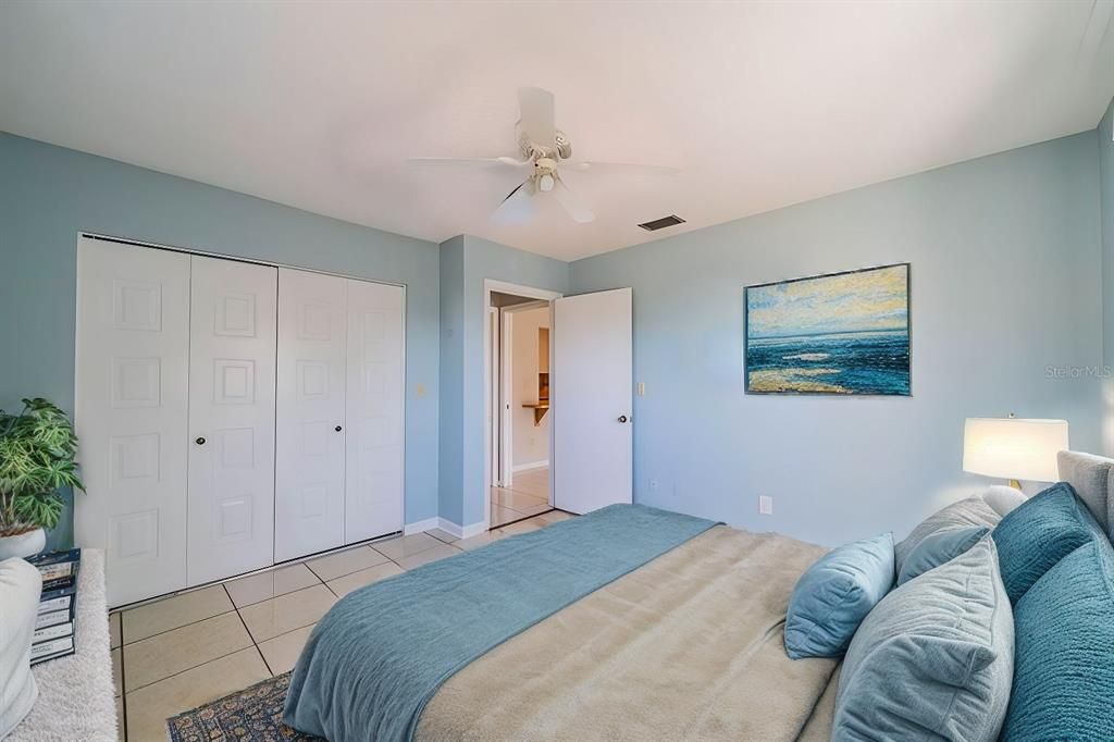 Guest bedroom with extended double wall closet