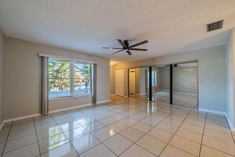 Living room with view of entrance and entry closet