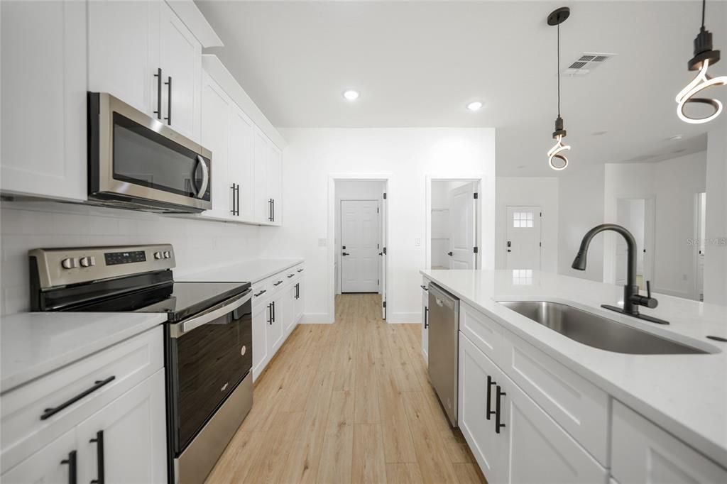 Kitchen area with laundry room and walk in panty closet