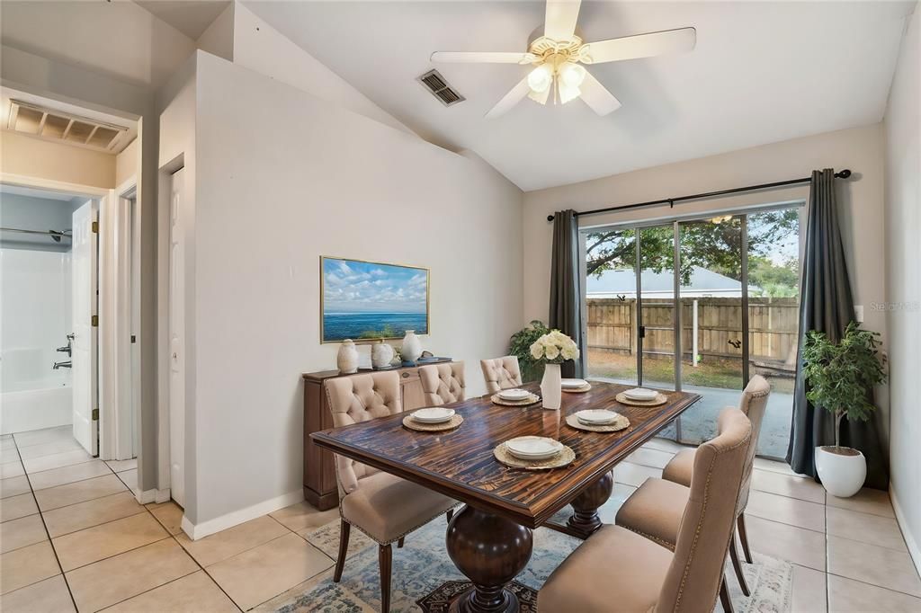 Dining area next to kitchen and overlooking backyard