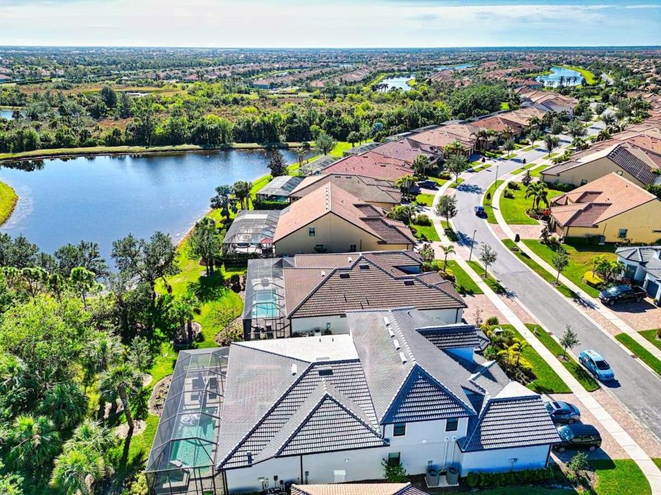 Subject is 1st house with pond in back