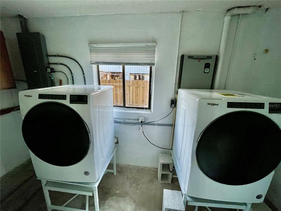 Laundry room off front entryway.