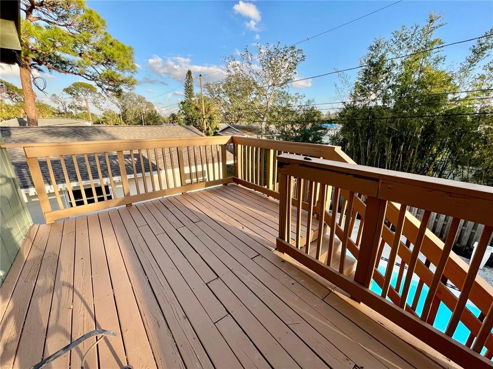 Marvelous open deck on 2nd level...stairs on right down to the pool.