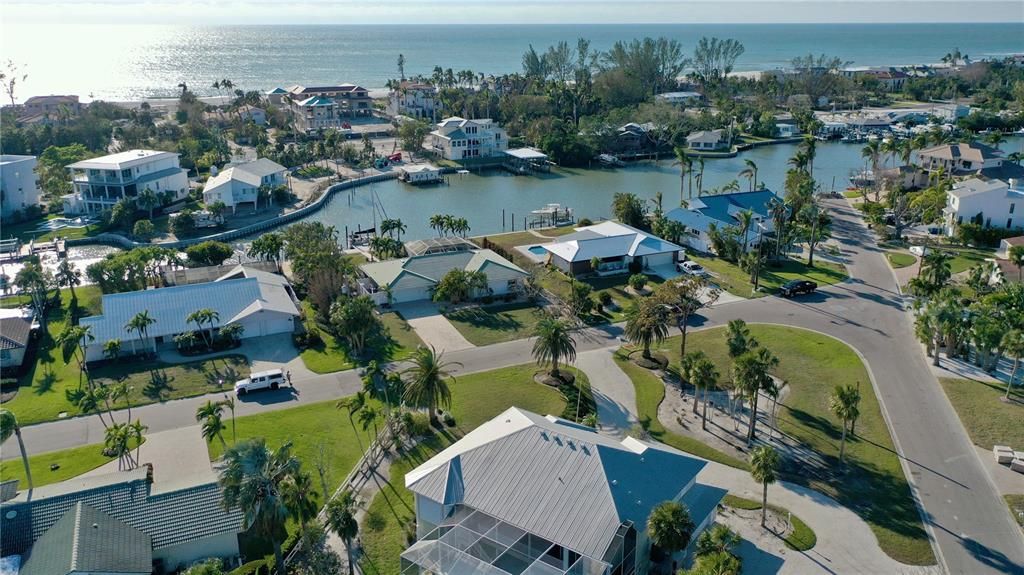 Aerial of front of home, canal and the Gulf of Mexico.