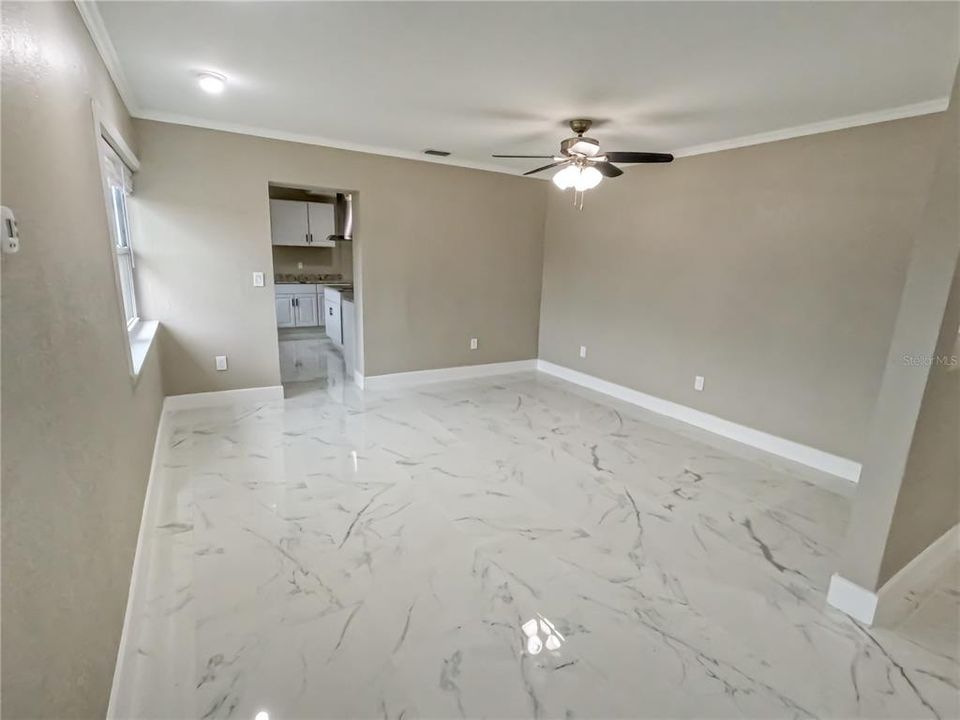 Gorgeous new flooring, neutral color pallet throughout, starting with the formal sitting room