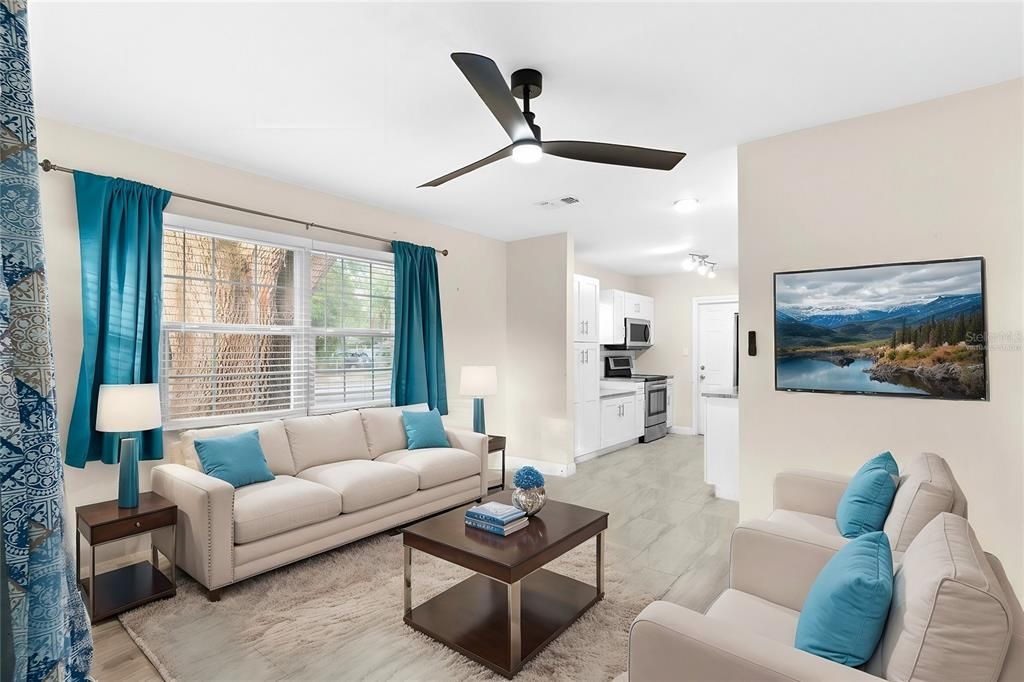 Living room open to kitchen virtually staged