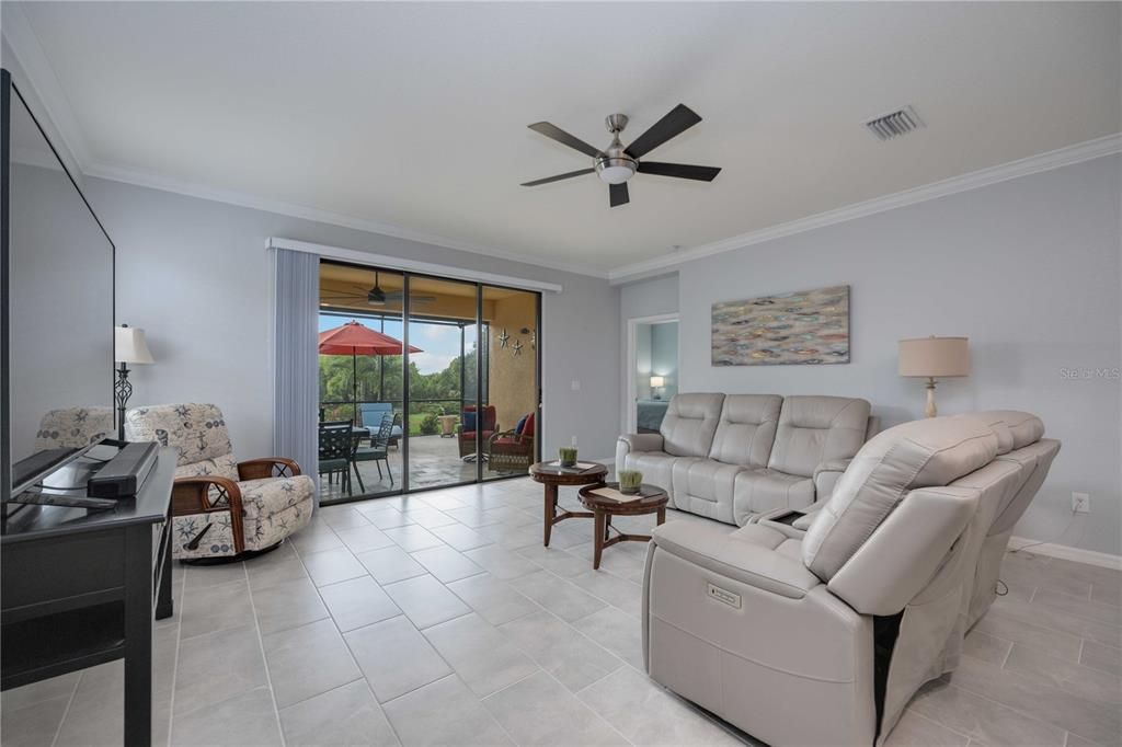 Livingroom with sliders leading out to the lanai