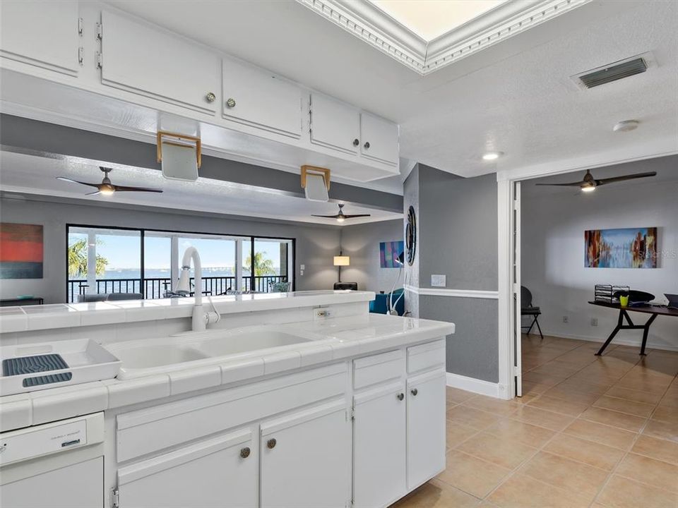 Kitchen looking towards enclosed patio and Charlotte Harbor